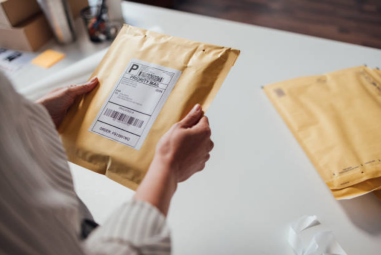 A person is holding a parcel