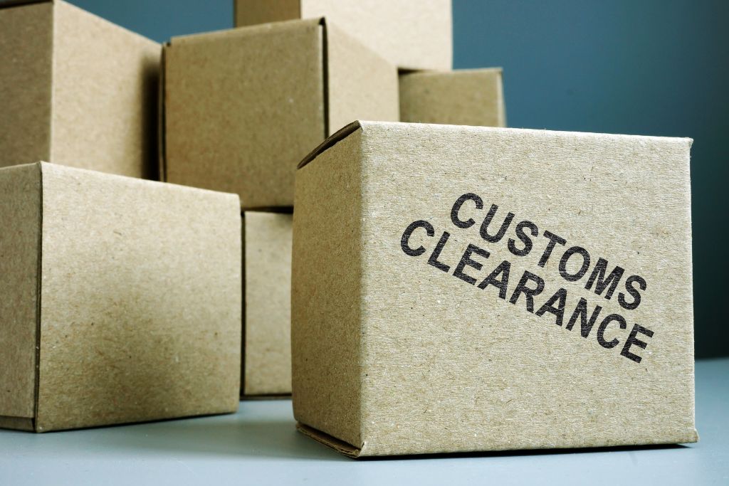 A box is labelled with customs clearance