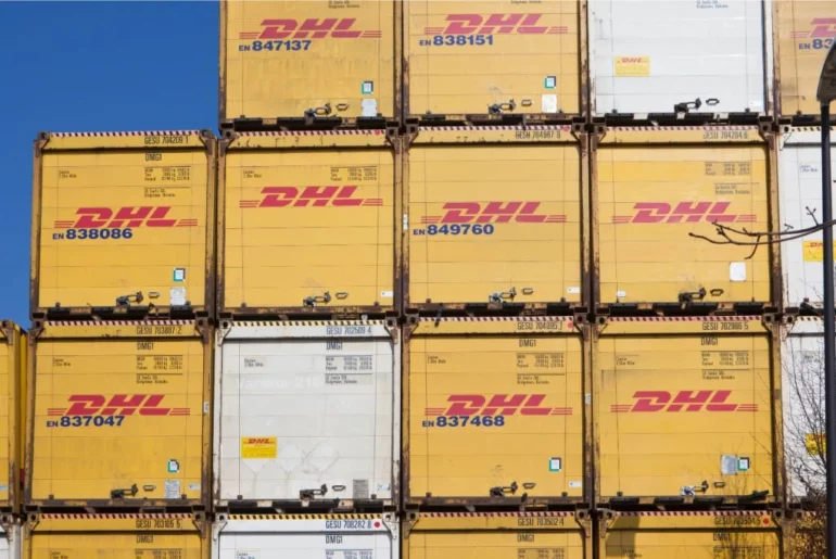 Stacks of piled DHL cargo ready for shipment.