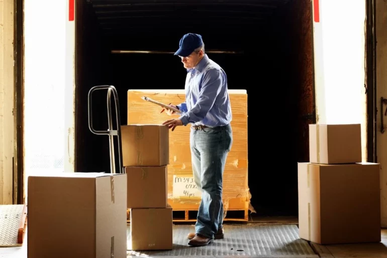 a man is working inside the warehouse