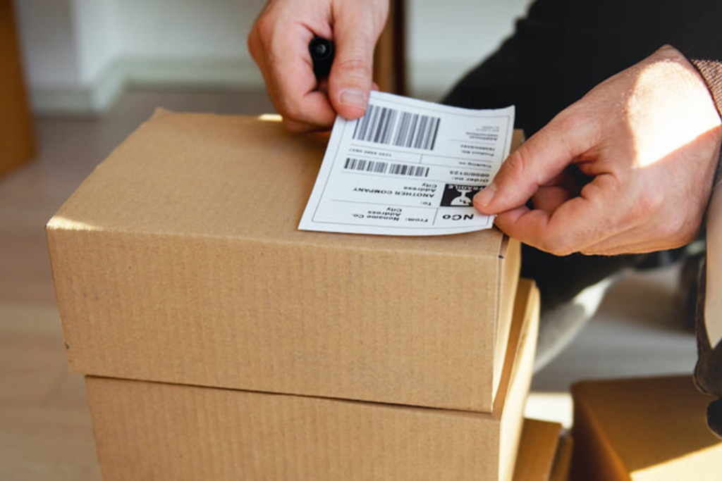 sticking a packing slip on parcel 