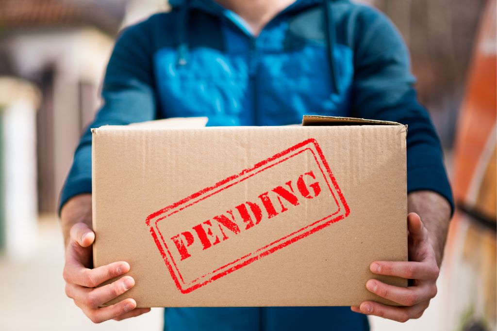 a man holding a pending package