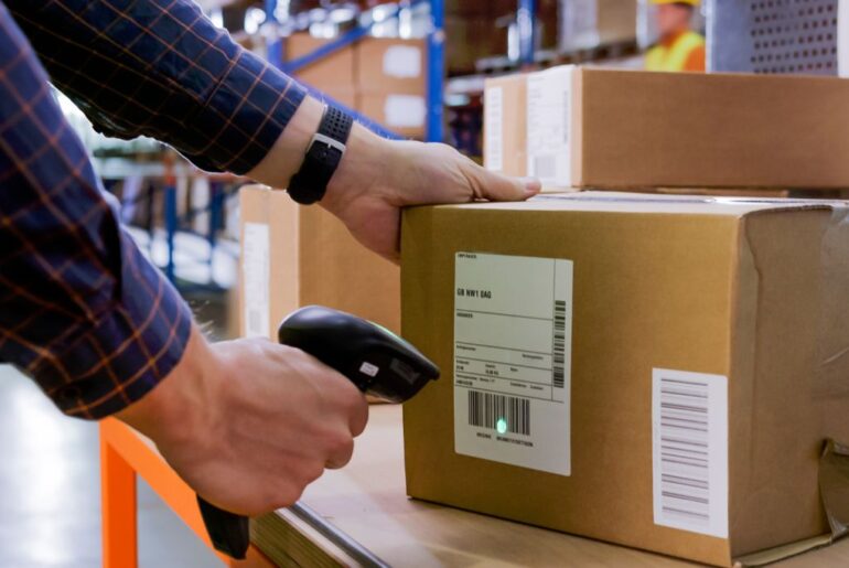 a man scanning a package